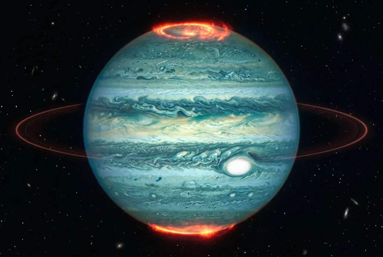 James Webb Space Telescope infrared image of Jupiter showing polar auroras, cloud bands, and faint rings